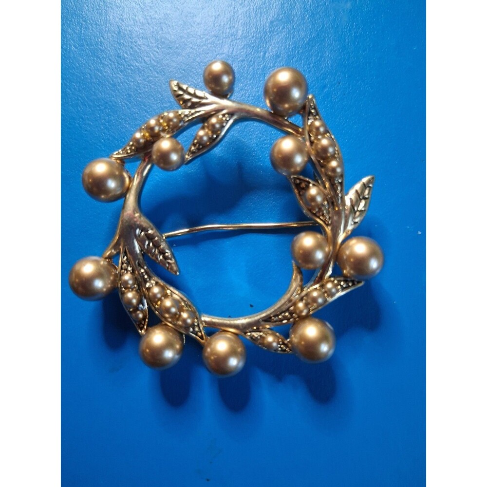 Vintage Monet Wreath Brooch With Gold Tone leaves & rounded bead-like elements